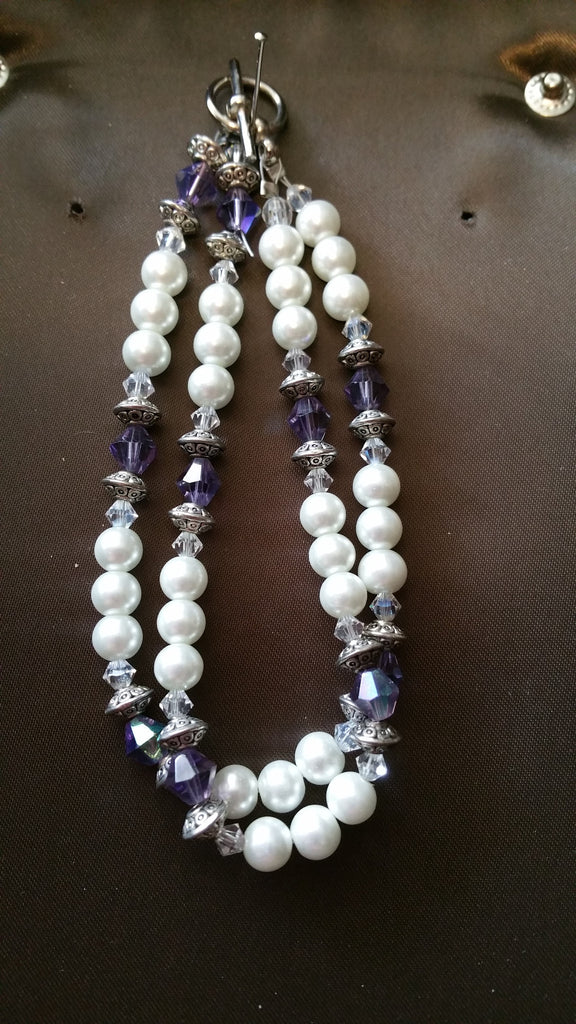 Double strand pearl coloured and glass bead bracelet